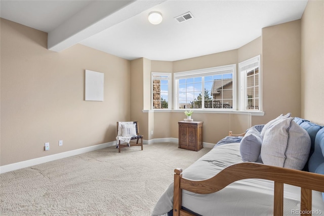 sitting room with light carpet and beamed ceiling