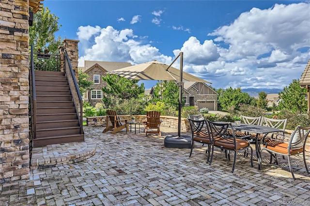 view of patio / terrace featuring glass enclosure