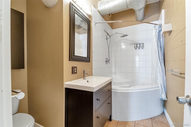 full bathroom featuring vanity, tile patterned flooring, toilet, and shower / tub combo with curtain