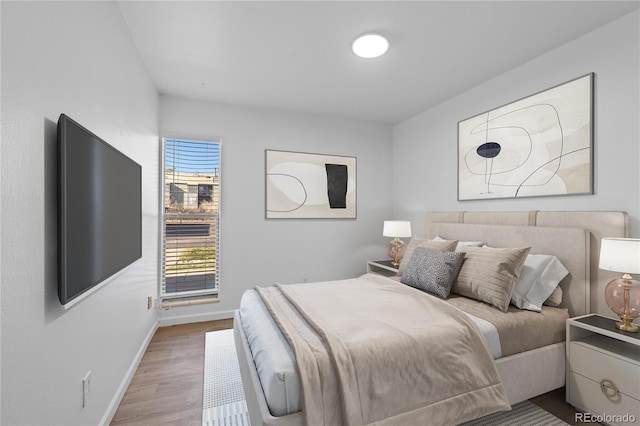 bedroom with light hardwood / wood-style flooring