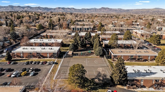 birds eye view of property with a mountain view