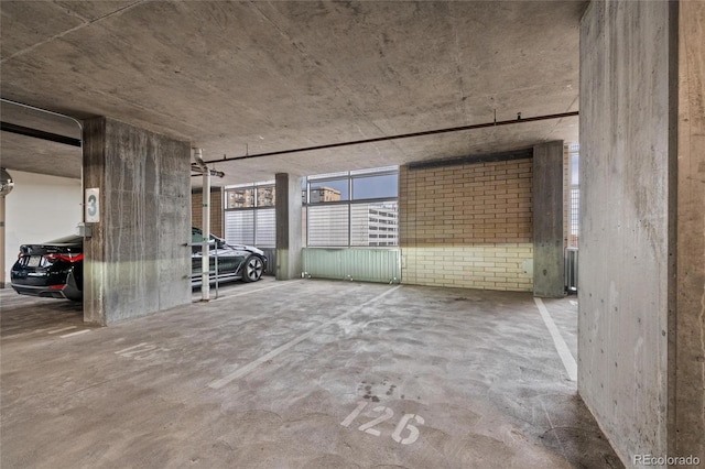 unfurnished room featuring concrete floors