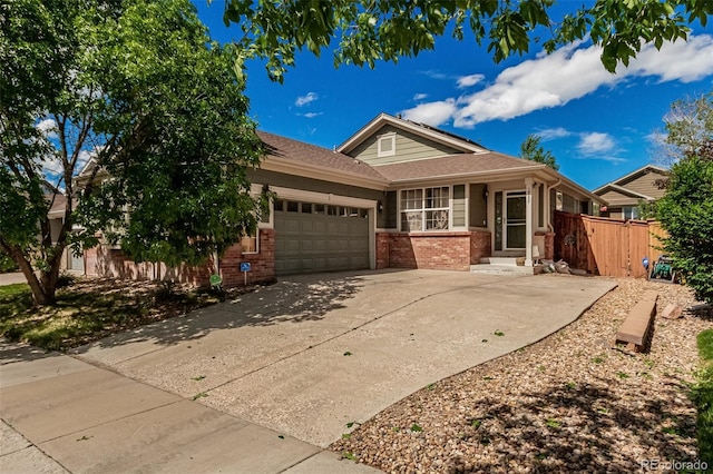 16257 E 105th Cir, Commerce City, CO 80022 - ranch-style house with brick siding, a garage, concrete driveway, and fence
