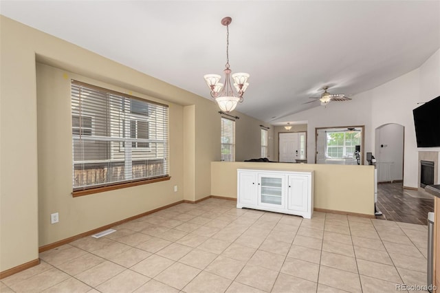 16257 E 105th Cir, Commerce City, CO 80022 - kitchen featuring open floor plan, ceiling fan, decorative light fixtures, lofted ceiling, and a tiled fireplace
