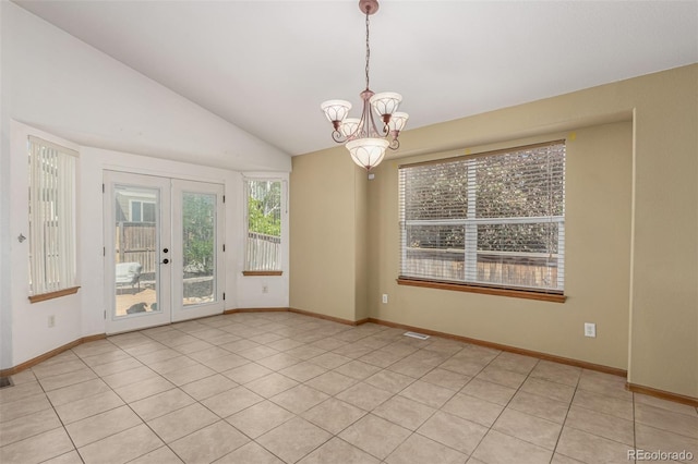 16257 E 105th Cir, Commerce City, CO 80022 - empty room with a chandelier, french doors, lofted ceiling, baseboards, and light tile patterned floors