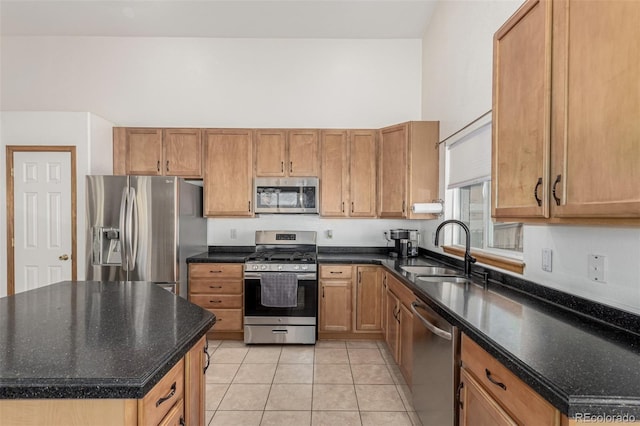 16257 E 105th Cir, Commerce City, CO 80022 - kitchen with stainless steel appliances, a sink, light tile patterned floors, a kitchen island, and brown cabinets
