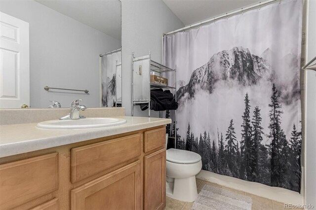 16257 E 105th Cir, Commerce City, CO 80022 - full bath with tile patterned flooring, vanity, toilet, and a shower with curtain