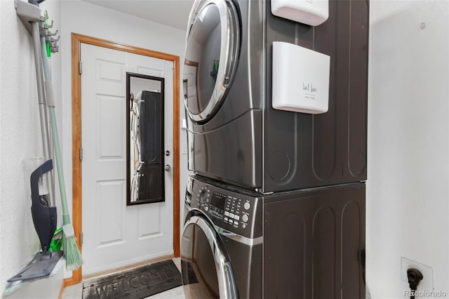 16257 E 105th Cir, Commerce City, CO 80022 - clothes washing area featuring stacked washer / dryer
