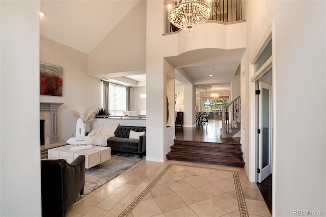 foyer featuring an inviting chandelier and a high ceiling