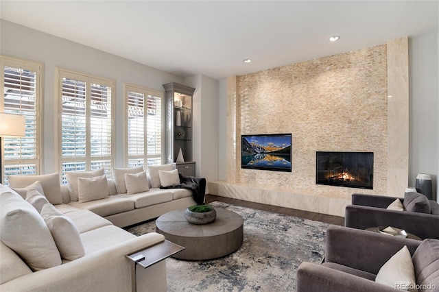 living room with hardwood / wood-style floors and a fireplace