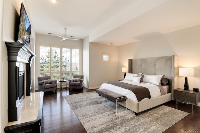 bedroom with dark wood-type flooring and ceiling fan