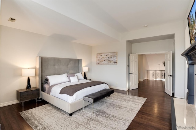 bedroom featuring dark wood-type flooring