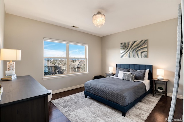 bedroom featuring dark hardwood / wood-style floors