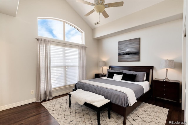 bedroom with ceiling fan, wood-type flooring, and high vaulted ceiling