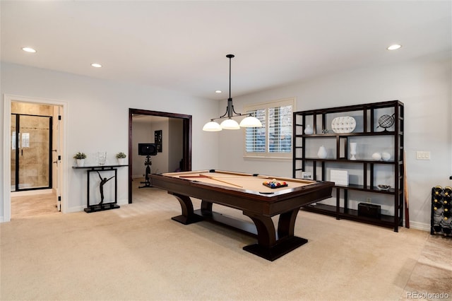 game room with pool table and light carpet