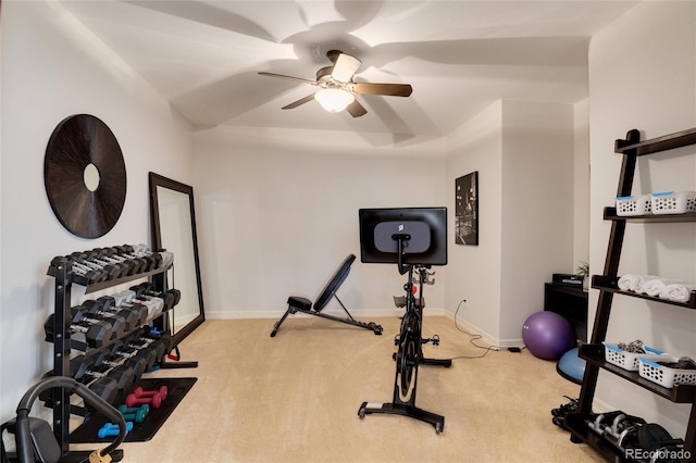 workout area with light colored carpet and ceiling fan