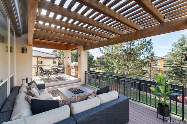 deck featuring area for grilling, a pergola, and an outdoor living space with a fire pit