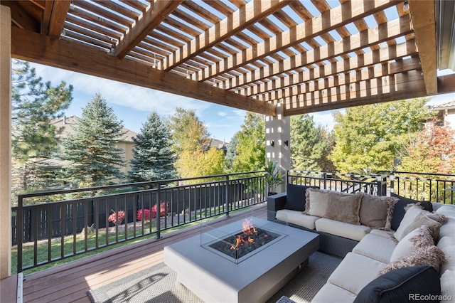 view of patio featuring an outdoor living space with a fire pit, a deck, and a pergola