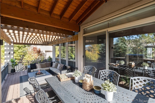 wooden deck with an outdoor living space and a pergola