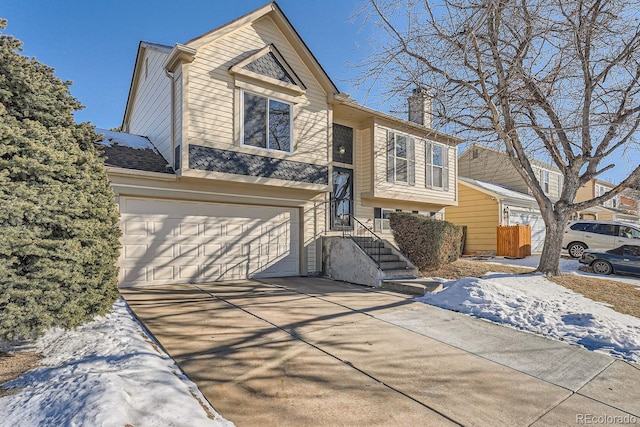 split foyer home featuring a garage