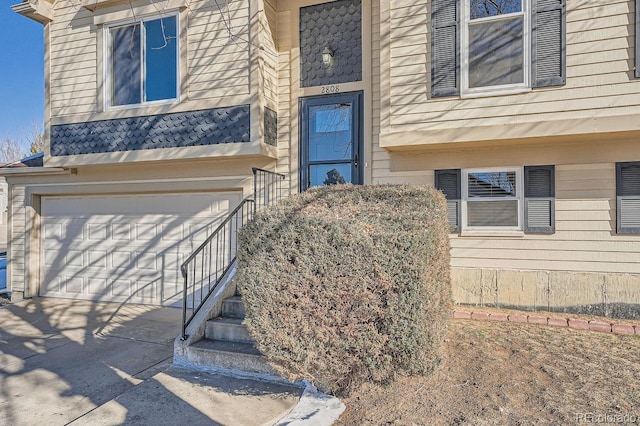 doorway to property featuring a garage