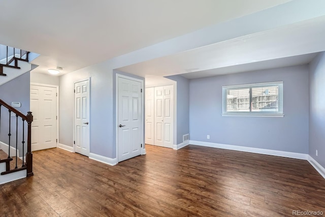 basement featuring dark hardwood / wood-style floors