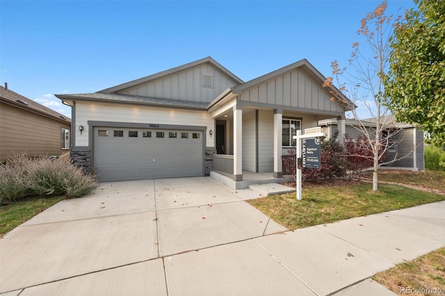 craftsman house with a garage and covered porch