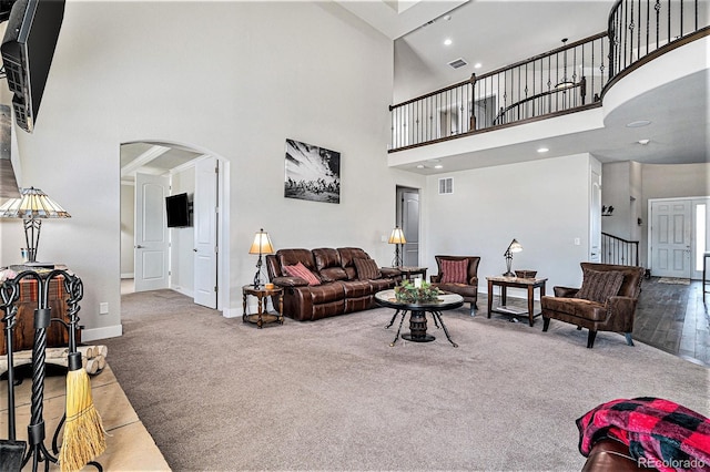 living room with a towering ceiling