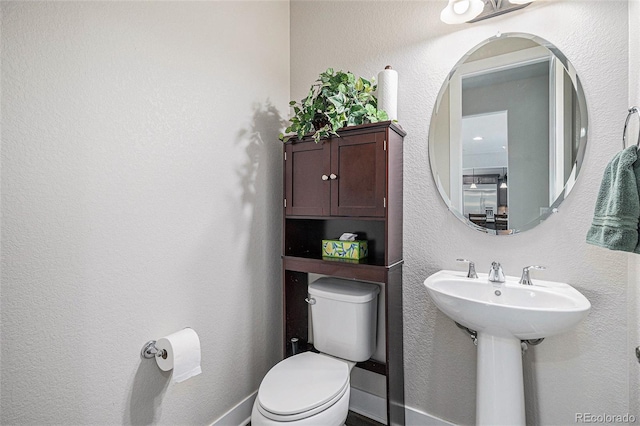 bathroom featuring toilet