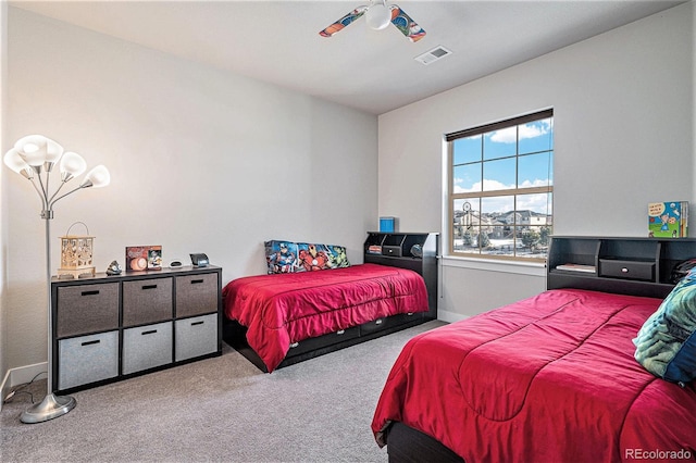 bedroom with ceiling fan and light colored carpet