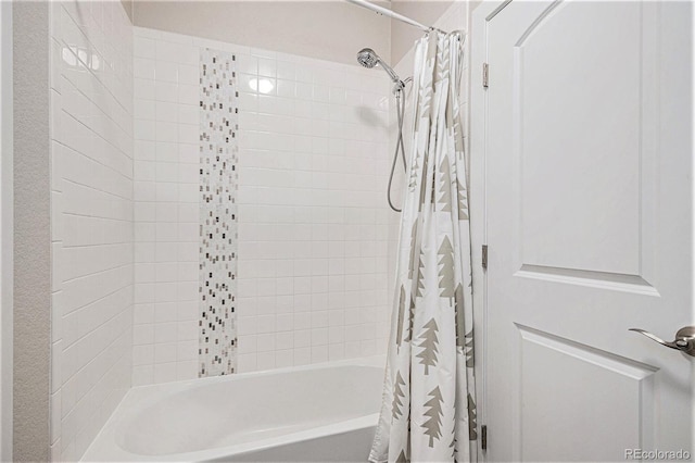 bathroom with shower / bath combination with curtain