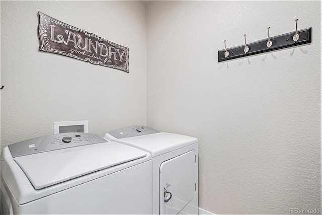 washroom featuring washer and clothes dryer