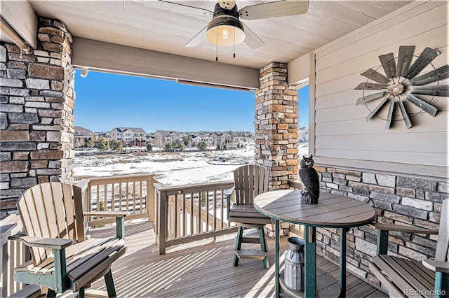 snow covered deck with ceiling fan