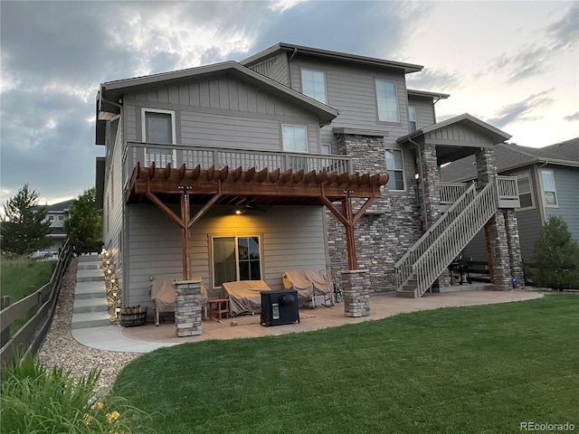 rear view of property with a patio area and a yard