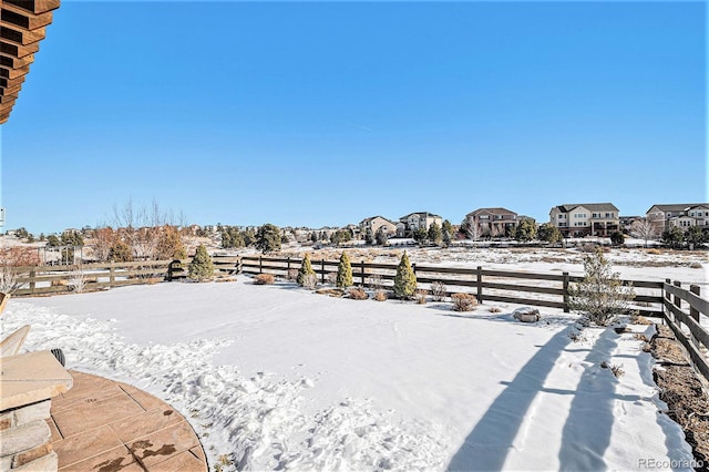 view of yard covered in snow