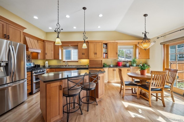 kitchen featuring a kitchen island, appliances with stainless steel finishes, open shelves, dark countertops, and custom range hood