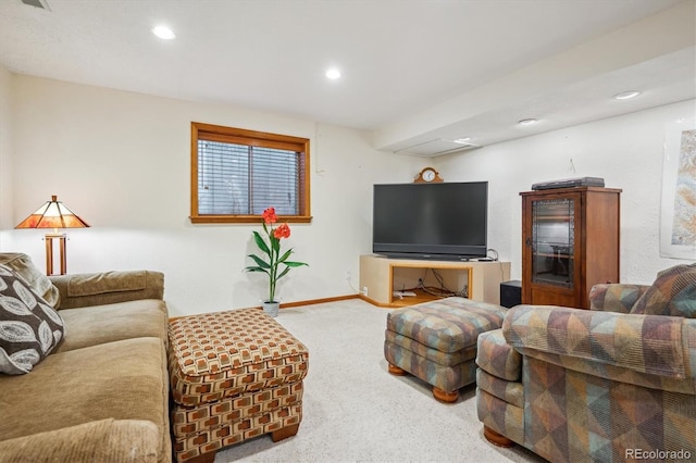 carpeted living area with recessed lighting and baseboards