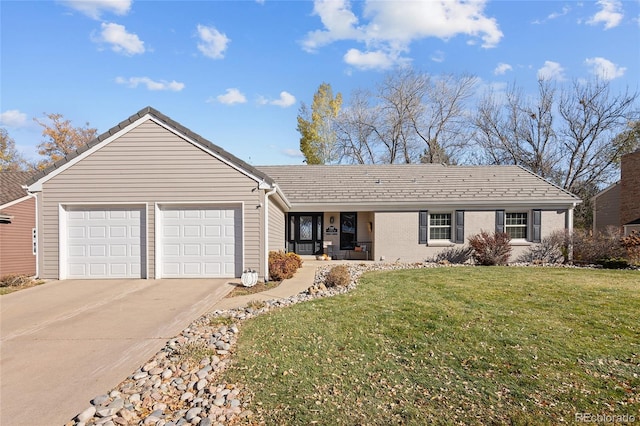 ranch-style home with a garage and a front lawn