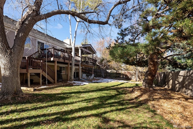 view of yard featuring stairs, a patio area, a deck, and a fenced backyard