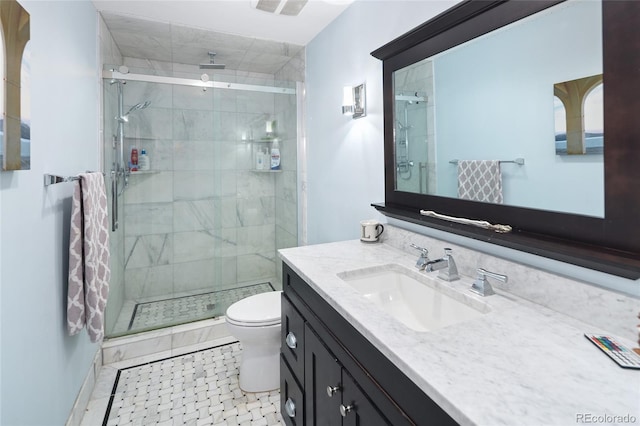 full bath with toilet, a stall shower, and vanity