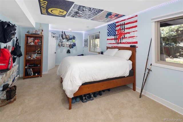 carpeted bedroom with baseboards