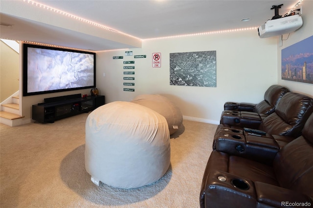 carpeted home theater with baseboards