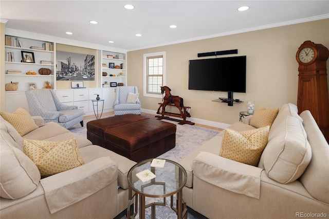 living area featuring crown molding, built in features, recessed lighting, and baseboards