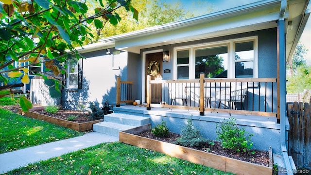 doorway to property featuring covered porch