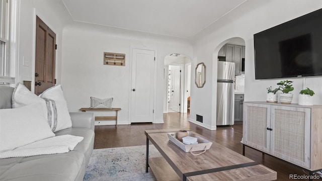 living room featuring dark wood-type flooring