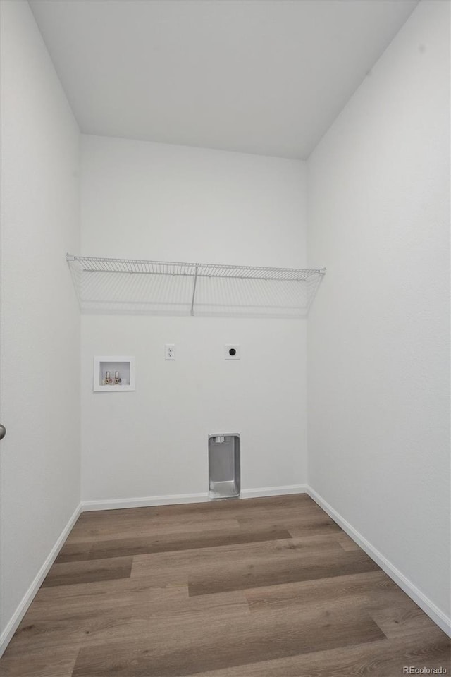 laundry area with washer hookup, electric dryer hookup, and wood-type flooring