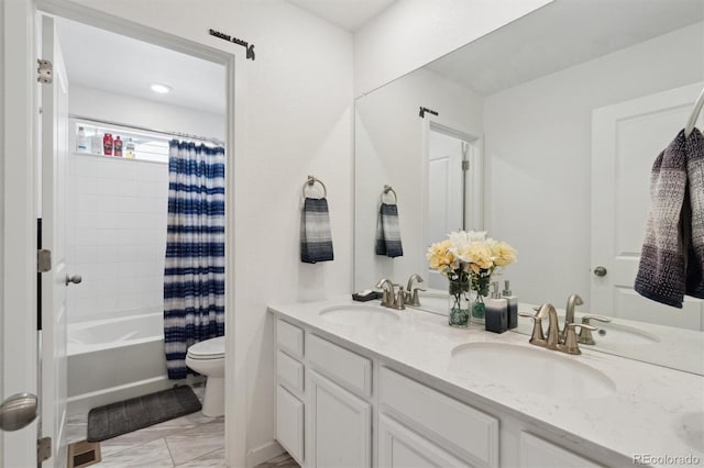 bathroom featuring toilet, marble finish floors, double vanity, and shower / bath combo