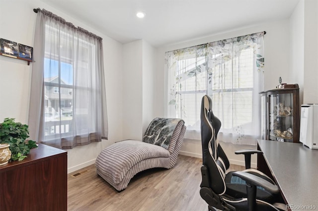 office space featuring light wood-style flooring, baseboards, and recessed lighting