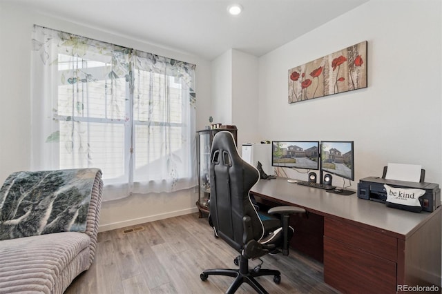 office with wood finished floors and baseboards