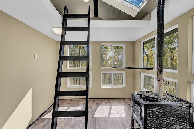 205 Ohler Ct, Jefferson, CO 80456 - stairway featuring a skylight, wood finished floors, and high vaulted ceiling